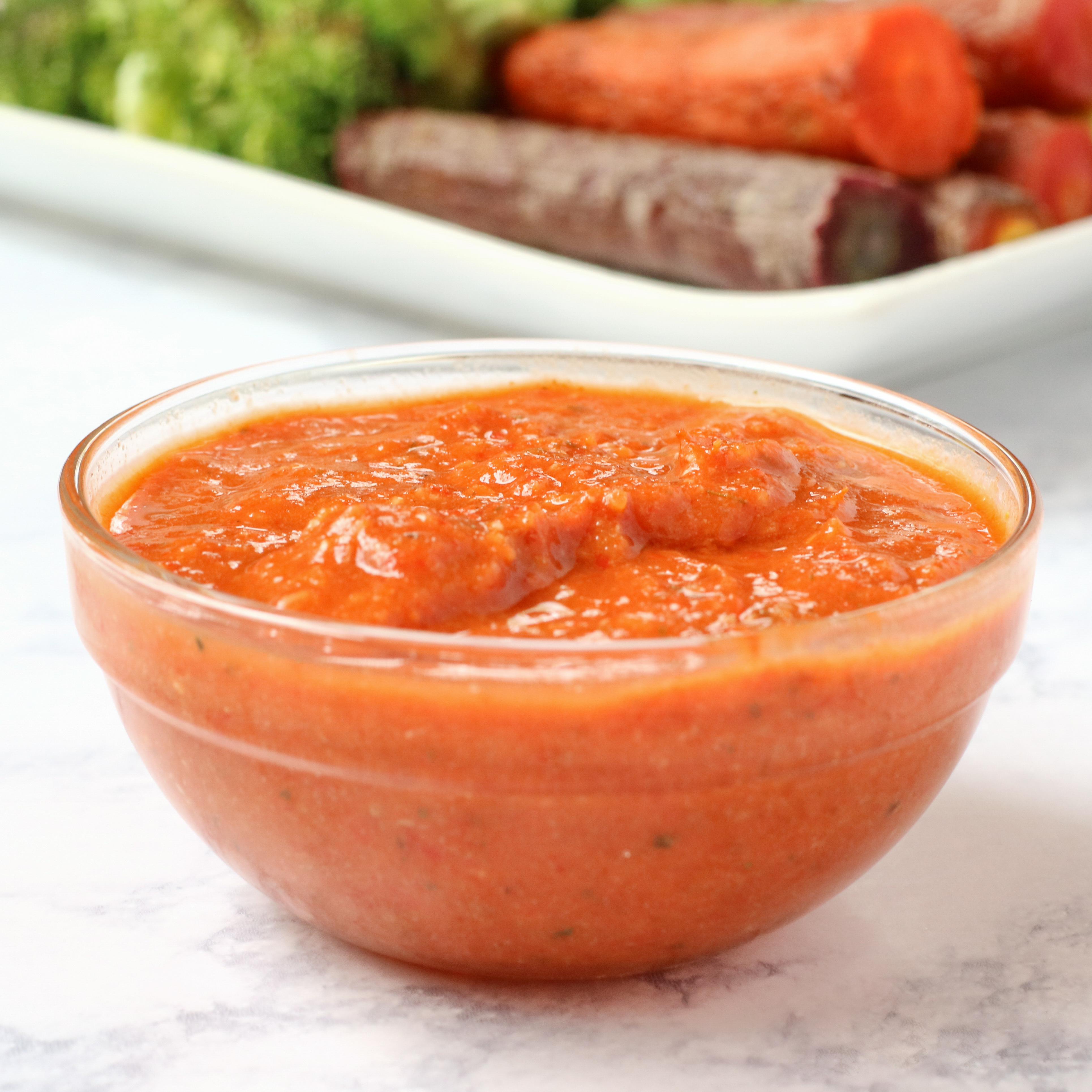 small glass bowl filled with harissa sauce